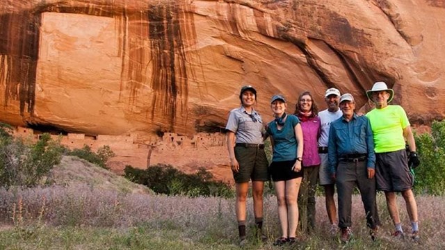 A group visiting Keet Seel with a ranger.