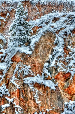 Shist rock cliff dusted with snow