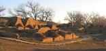 Low-angle winter sun light shines thorugh ruins.