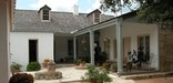 A Spanish colonial home and interior courtyard at Casa Navarro State Historic Site in Texas