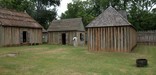 Rough hewn log cabins at Fort St. Jean Baptiste in Louisiana