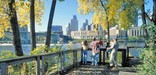 Visitors look across the river to downtown.