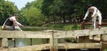Photo of lock keepers tending lock 20