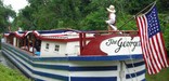 Photo of American Flag on stern of Georgetown canal boat.