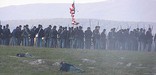 Men in field during 2005 battle reenactment