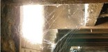 Photo of spiderweb in Poe's basement