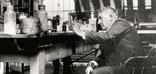 Thomas Edison working in his chemistry laboratory.