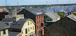 A panoramic view of historic buildings and the waterfront in New Bedford