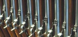 Close-up of some of the 645 Springfield Civil War-era rifle muskets in a 1830's rack.
