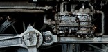 The air pump, which supplies compressed air for the brakes, sits above the main drive rods. NPS Photo, Ken Ganz