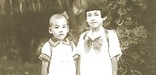 Akira Manago and his sister, Hisako, in the garden of their South Garapan, Saipan home in April 1941