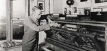 Eugene O'Neill changing the music rolls in his player piano called Rosie in 1941 - Yale Beinecke Library Photo