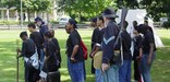Park Rangers use military uniforms and equipment to help students learn about the site's military history.