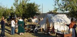 Volunteers in the Oregon Trail Camp provide interpretation for the annual Candlelight Tour special event.