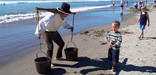 Salt Maker carrying sea water