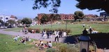 Visitors enjoy the lawns near the sandy beach at Aquatic Park Historic District.