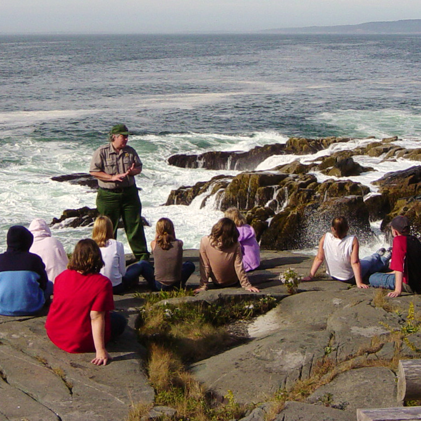 An education Park Ranger instructing students along the Schoodic shoreline.
