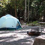 Campsite with tent and fire ring