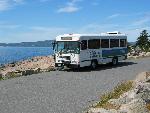 Bus parked along shoreline