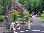 Brown building with landscaped grounds