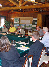 Partners meet inside Schooner Club.