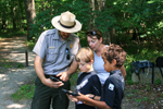 A ranger helps out some visitors.