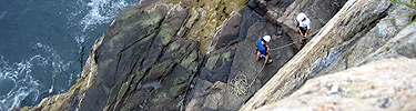 Climbers at base of Otter Cliff.