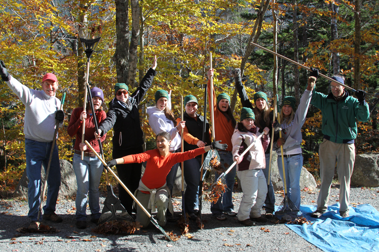 University of Maine students pose with rakes on an Acadia carriage road during the 2011 Take Pride in Acadia Day.
