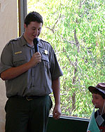 Park ranger talks on microphone