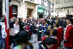 A mob gathers around the soldiers