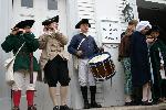 A fife and drum group entertain the crowd