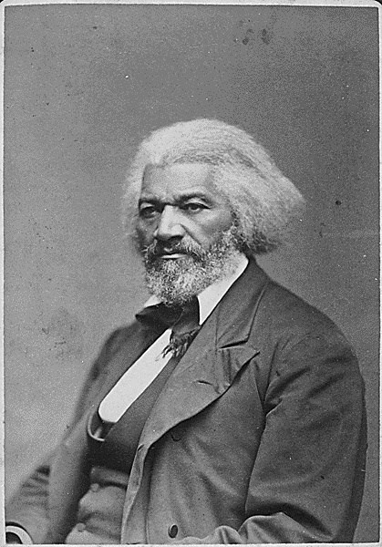 Black and white photo of Frederick Douglass seated