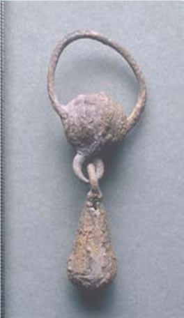Silver pendant recovered with Burial 254