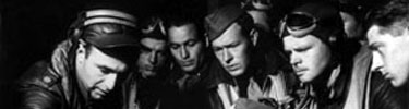 Maj. Milton Askins gives a preflight briefing to the 54th Fighter Squadron before a raid on Japanese-occupied Kiska