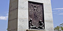 Bronze panel showing a prison scene on the back of a stone monument Bronze panel showing a prison scene on the back of a stone monument