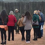 Park ranger talks with students at the prison site