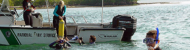 University of Miami students and National Park staff snorkel and dive to retrieve samples for the coral reef nursery.