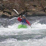 Kayaking on the river.