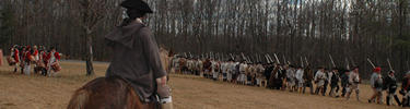 commander watching troops march to battle