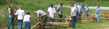 Youth Conservation Corps and park maintenance from Cowpens National Battlefield and Ninety Six NHS building a split rail fence