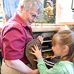 Image of educator, child and track mold