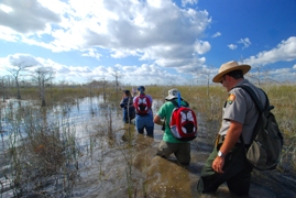 Visitors and ranger on slough slog