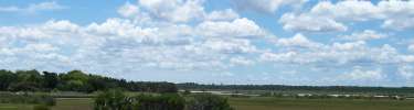 The wide summer sky over the marsh at Fort Matanzas