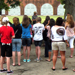 A Park Ranger talks with students inside the fort.