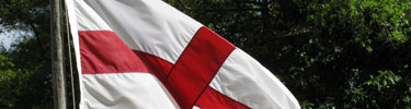 The colors of England (red cross on white field) fly at the restored fort at Fort Raleigh