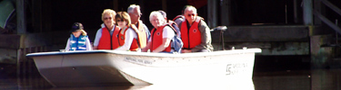 Visitors explore the bayou in a ranger guided john boat tour.