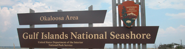 The brown entrance sign for the Okaloosa Day Use Area.