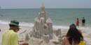 Visitors observe a sand castle on Perdido Key Beach in Florida. Visitors observe a sand castle on Perdido Key Beach in Florida.