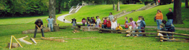 Picture of a rail splitting demonstration for school groups