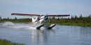 A DeHavilland Beaver float plane lands on the Alagnak Wild River. A DeHavilland Beaver float plane lands on the Alagnak Wild River.
